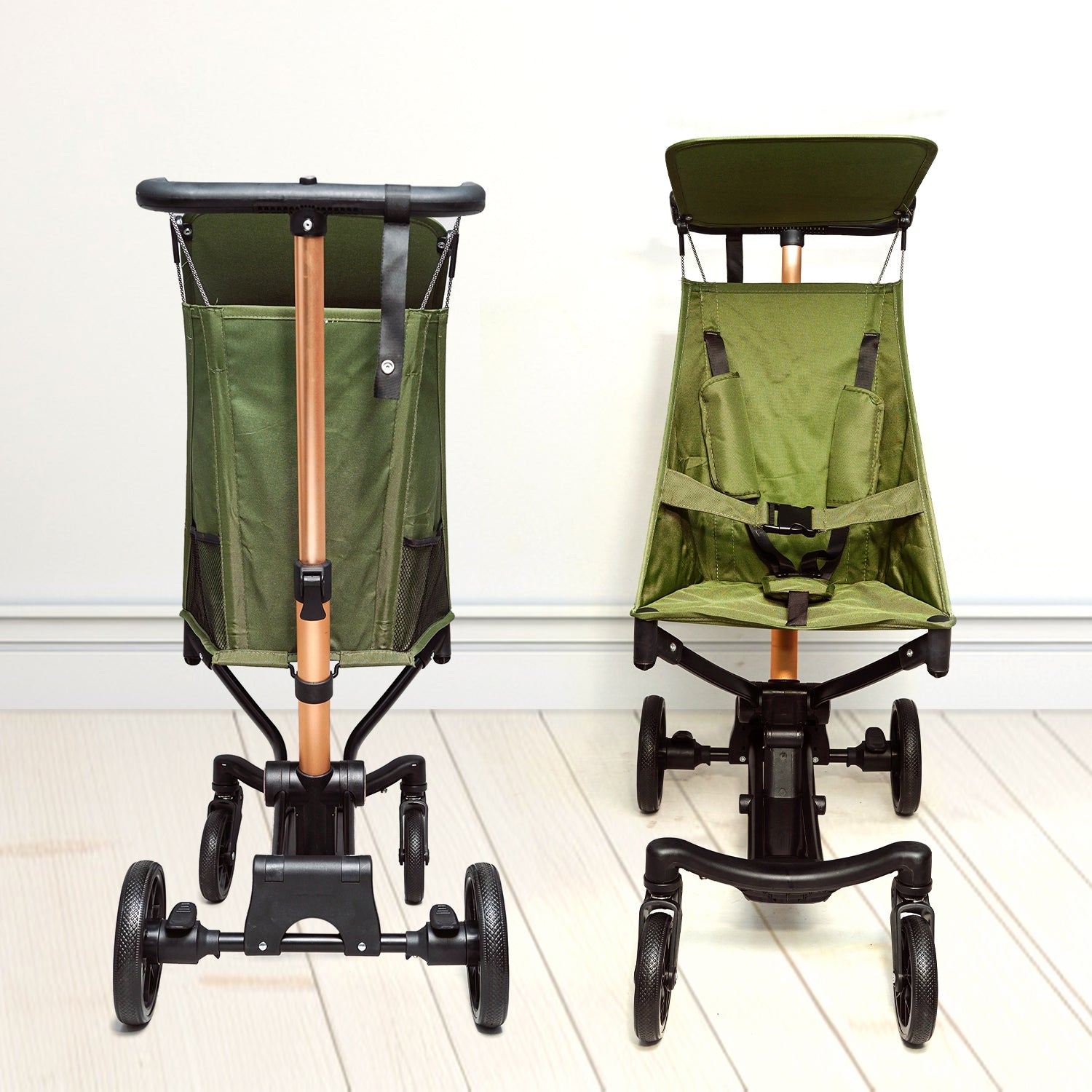 Green stroller with attached seat and storage bag on a white floor.